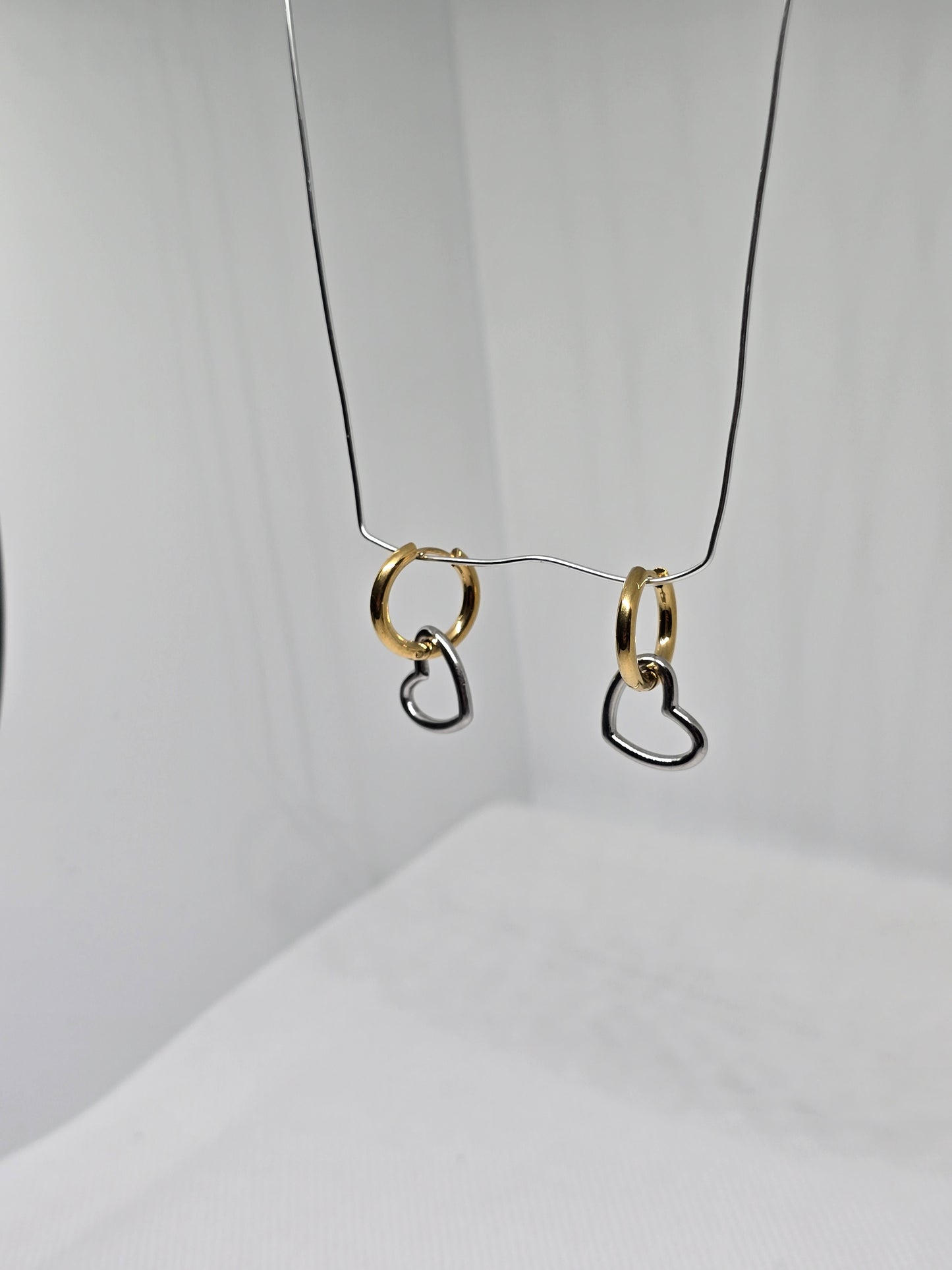 Silver hearts on Gold circles earrings - By Bianci